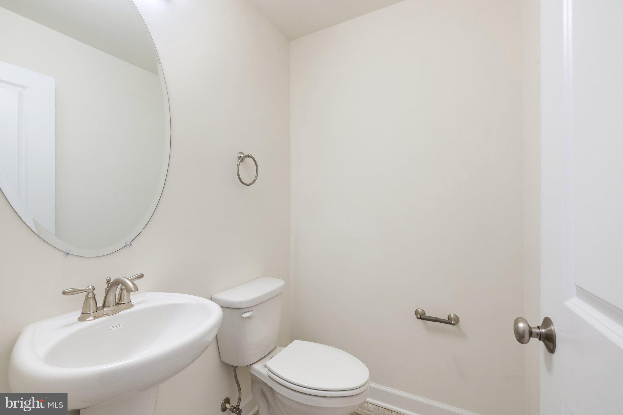 141 Oak View Street Culpeper, VA 22701 - Photo 8 of 46 a bathroom with a sink toilet and a mirror