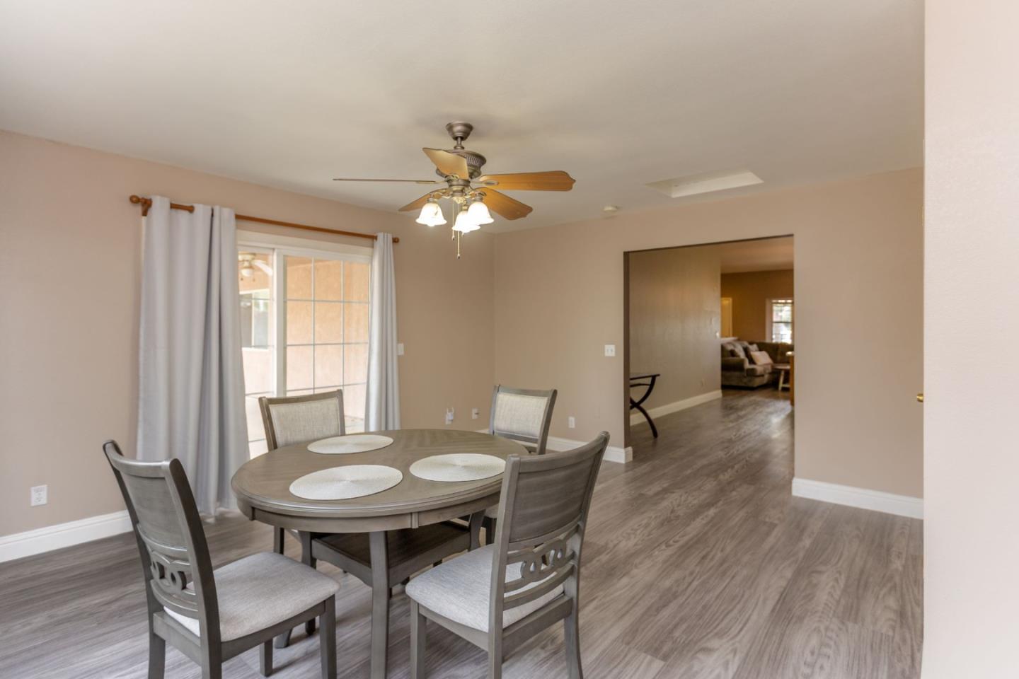 2085 Roth Court Turlock, CA 95380 - Photo 14 of 26 a view of a dining room with furniture and wooden floor