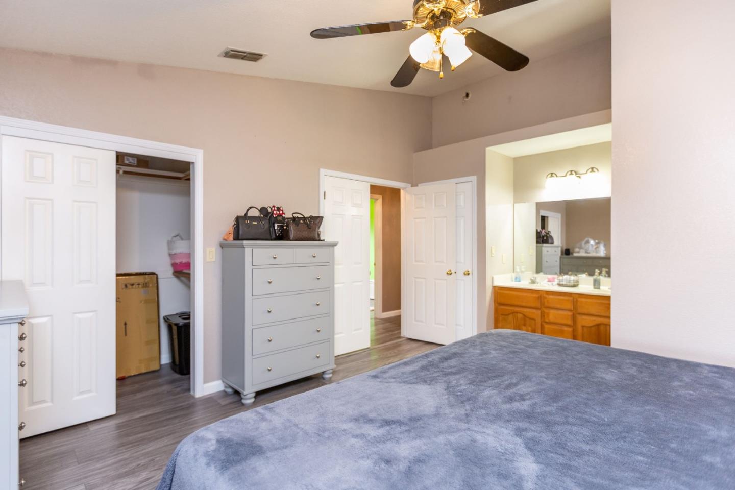 2085 Roth Court Turlock, CA 95380 - Photo 17 of 26 a view of a bedroom with cabinet cabinet and a bathroom