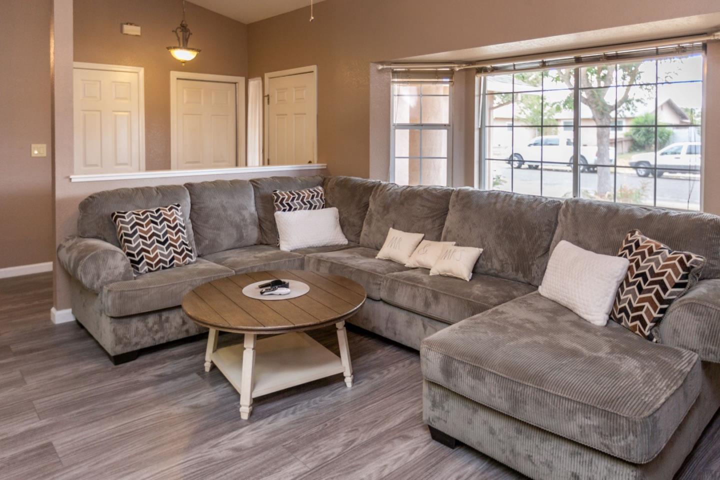 2085 Roth Court Turlock, CA 95380 - Photo 3 of 26 a living room with furniture and a large window