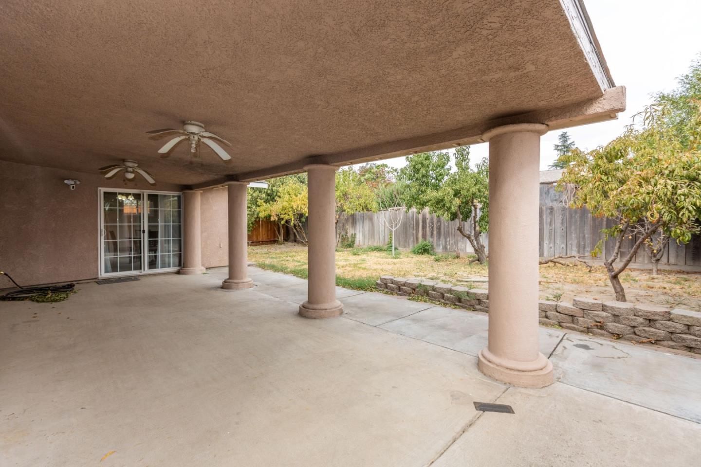 2085 Roth Court Turlock, CA 95380 - Photo 25 of 26 a view of a house with porch and garden