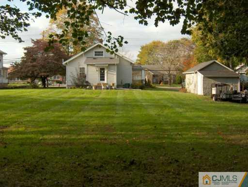 631 Ridge Road Monmouth Junction, NJ 08852 - Photo 3 of 8 a front view of a house with a garden