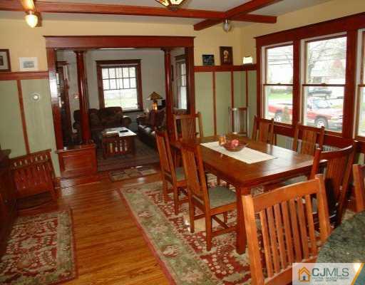 631 Ridge Road Monmouth Junction, NJ 08852 - Photo 4 of 8 a view of a dining room with furniture window and wooden floor