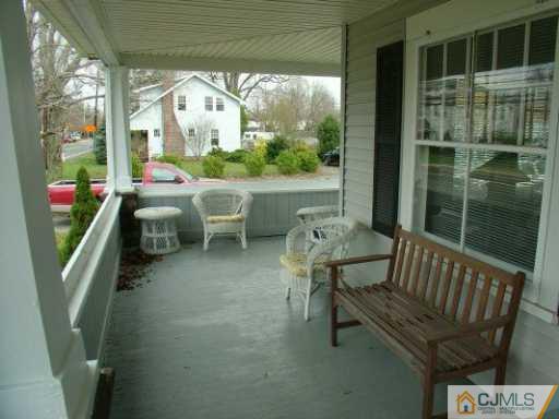 631 Ridge Road Monmouth Junction, NJ 08852 - Photo 7 of 8 a view of a porch with furniture