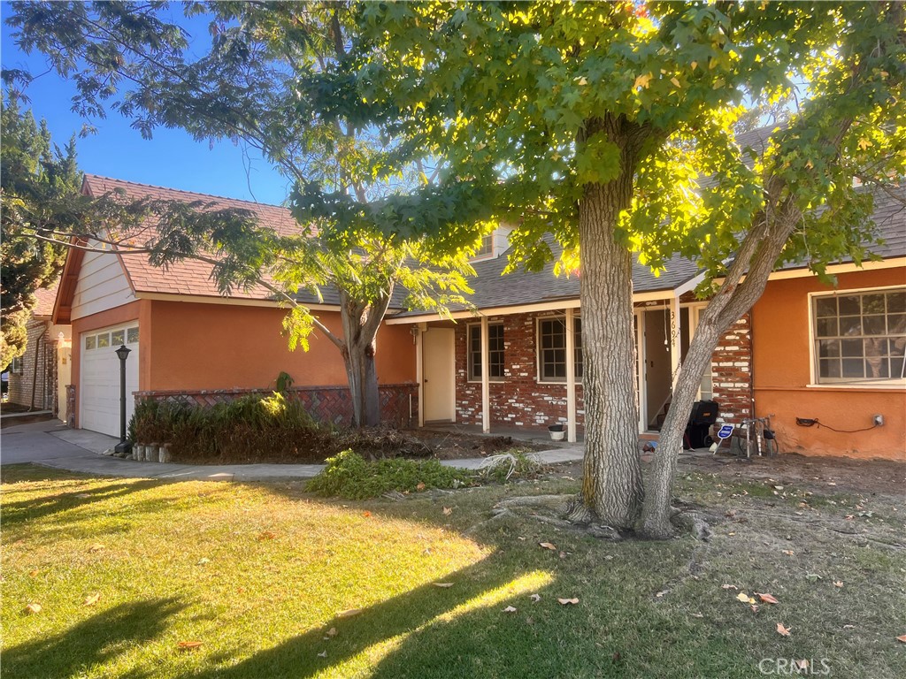 3694 Gay Way Riverside, CA 92504 - Photo 1 of 26 a front view of house with yard and trees in the background