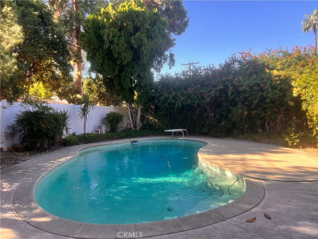 3694 Gay Way Riverside, CA 92504 - Photo 12 of 26 a view of a swimming pool with a yard