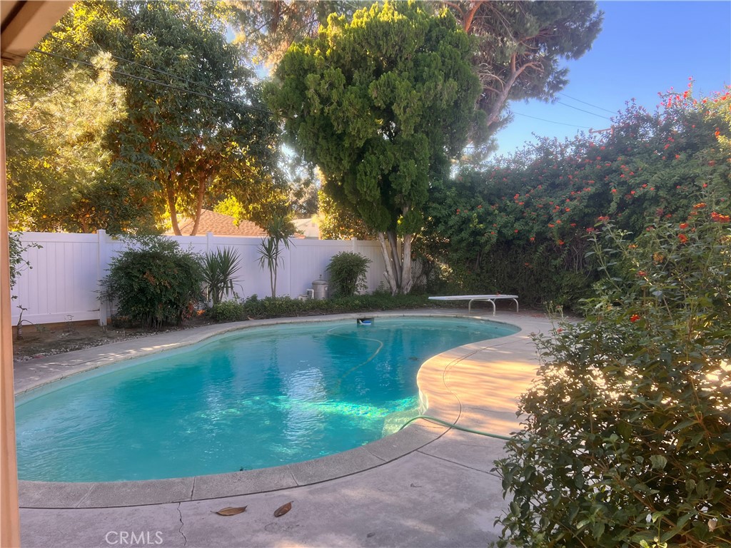 3694 Gay Way Riverside, CA 92504 - Photo 13 of 26 a view of a swimming pool with a yard