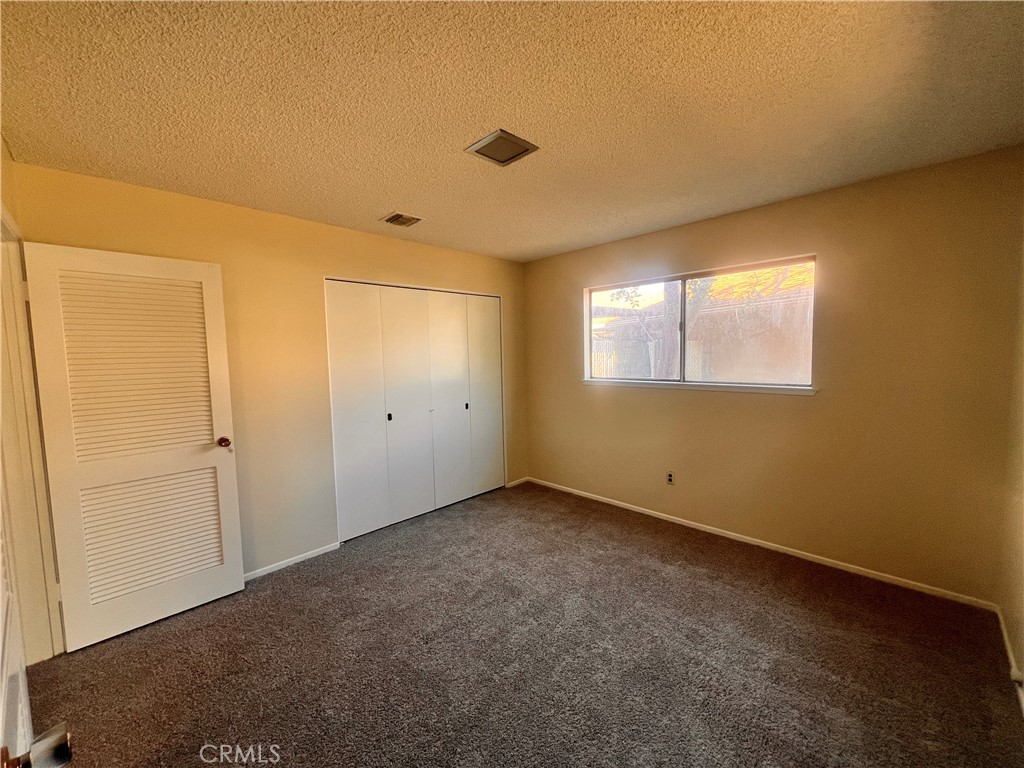3694 Gay Way Riverside, CA 92504 - Photo 17 of 26 a view of an empty room with a window
