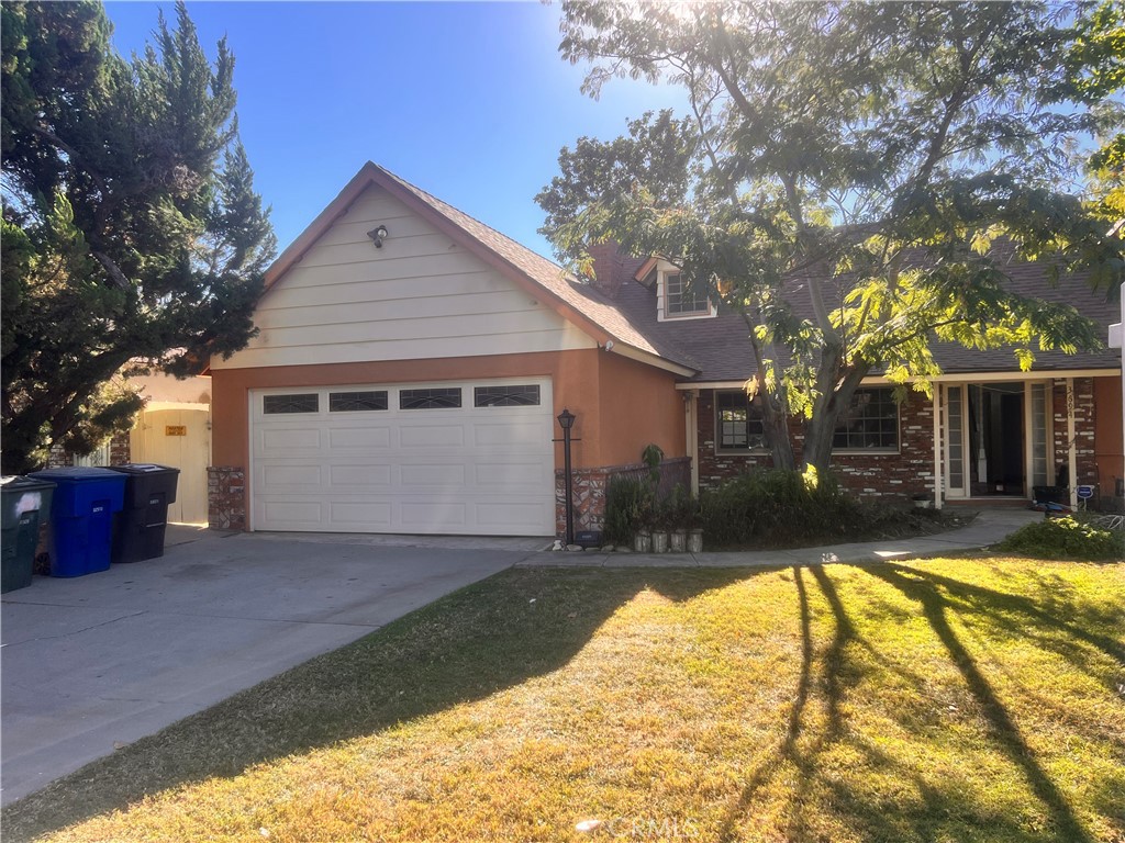 3694 Gay Way Riverside, CA 92504 - Photo 4 of 26 a view of a house with a yard and tree s