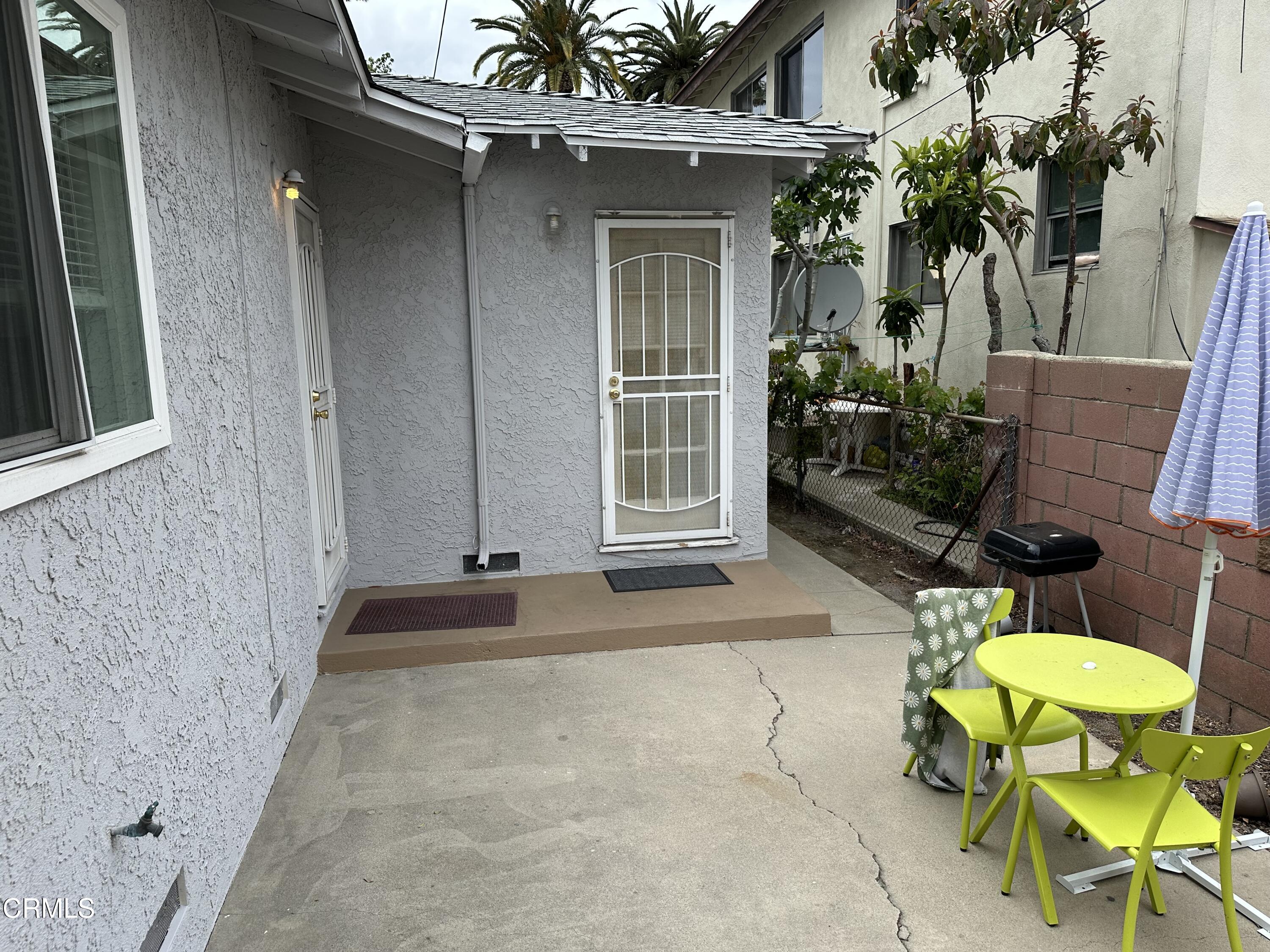 1148 Spazier Avenue, Unit B Glendale, CA 91201 - Photo 26 of 31 a view of a chair and table in backyard of a house