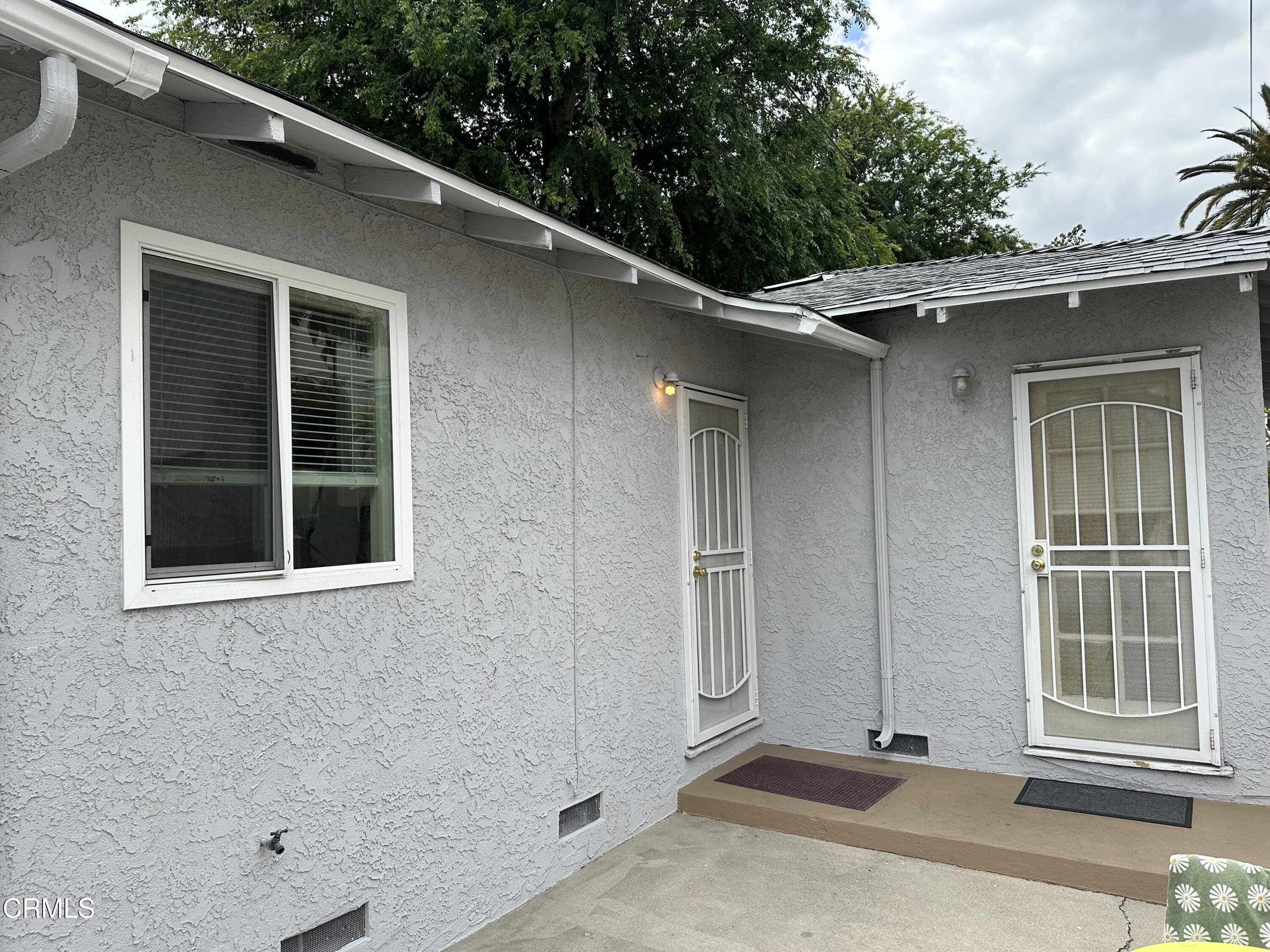 1148 Spazier Avenue, Unit B Glendale, CA 91201 - Photo 29 of 31 a side view of a house with a large window