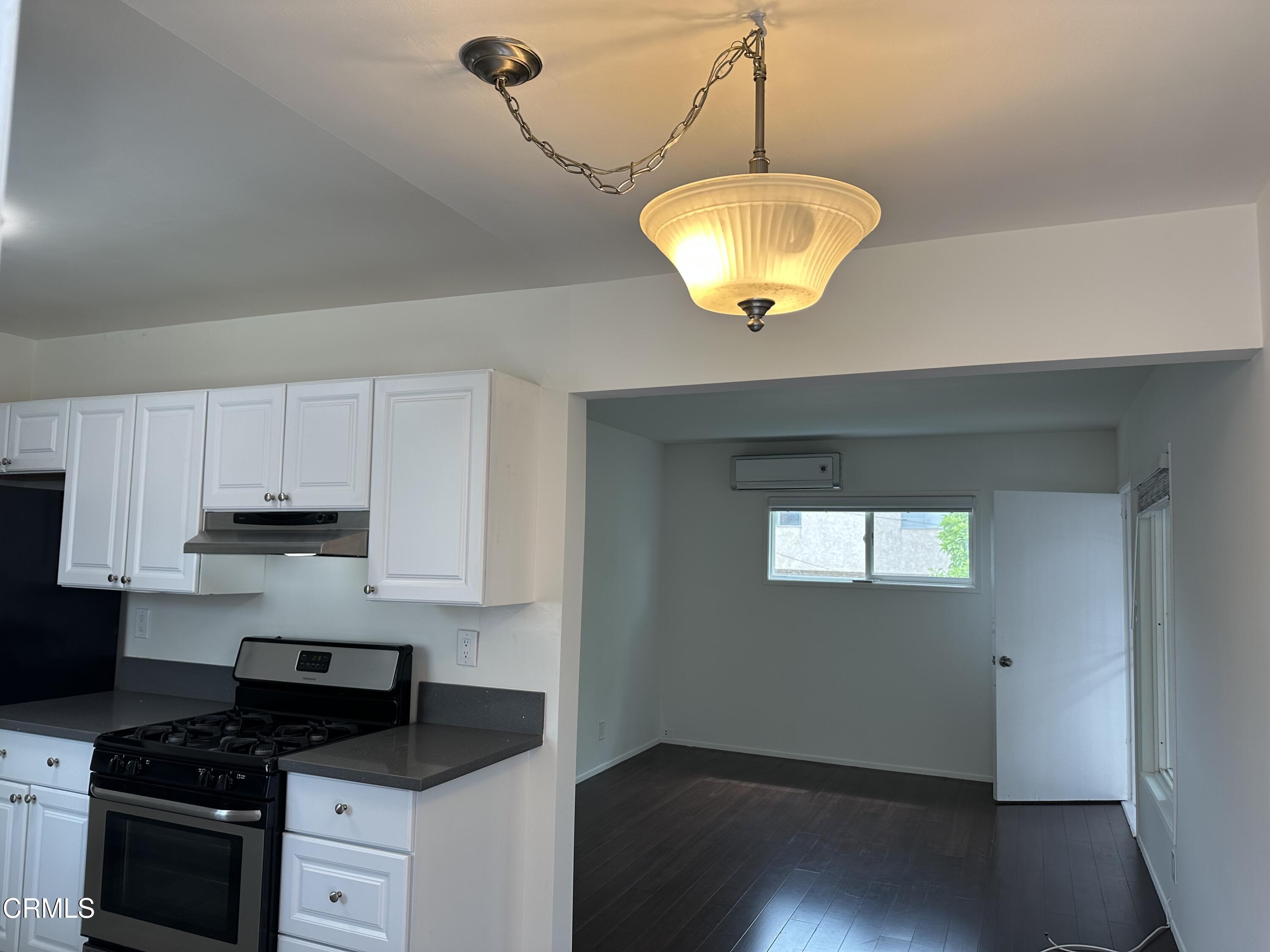 1148 Spazier Avenue, Unit B Glendale, CA 91201 - Photo 7 of 31 a kitchen with cabinets and window