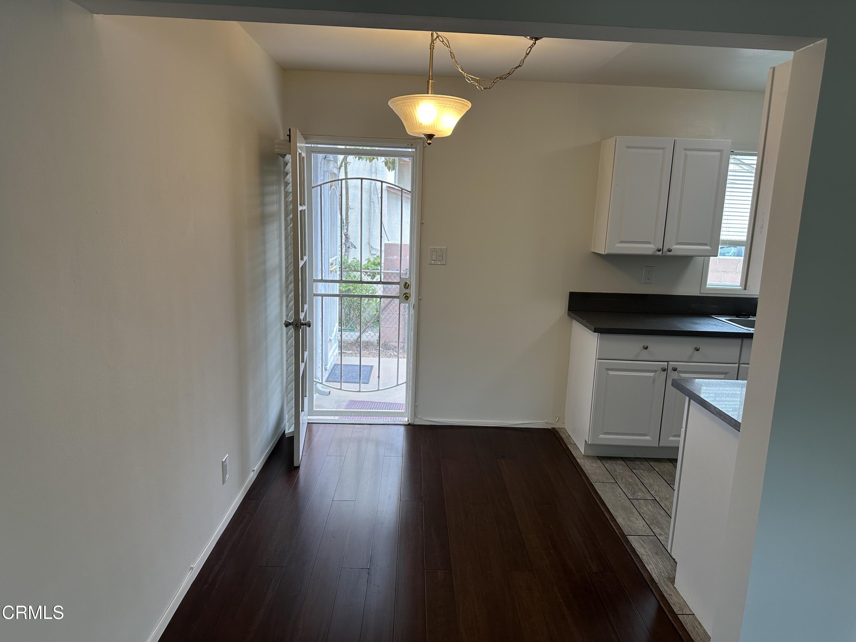 1148 Spazier Avenue, Unit B Glendale, CA 91201 - Photo 9 of 31 a view of hallway with wooden floor and staircase