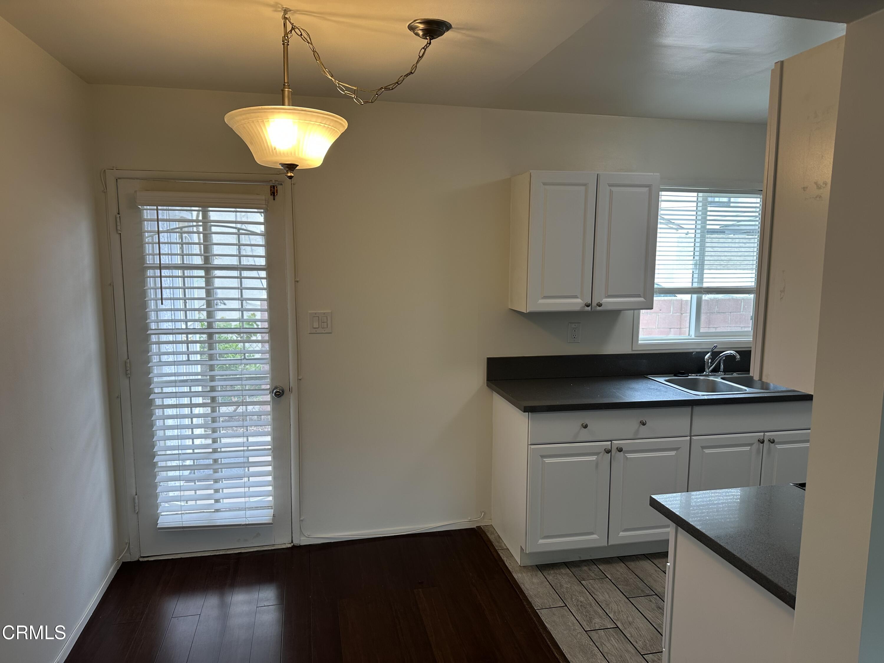 1148 Spazier Avenue, Unit B Glendale, CA 91201 - Photo 10 of 31 a kitchen with a sink and chandelier