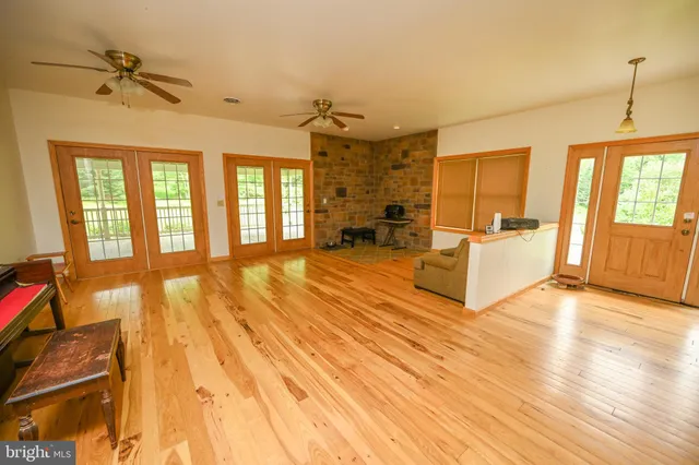a room with wooden floor and furniture