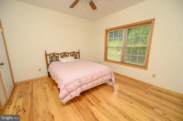 a bathroom with a sink a toilet and shower curtain