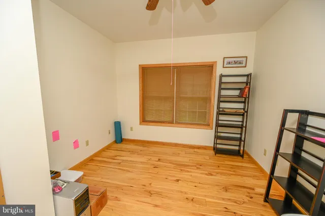 a view of empty room with a sink and painted walls