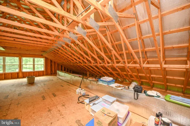 a view of a porch with wooden floor