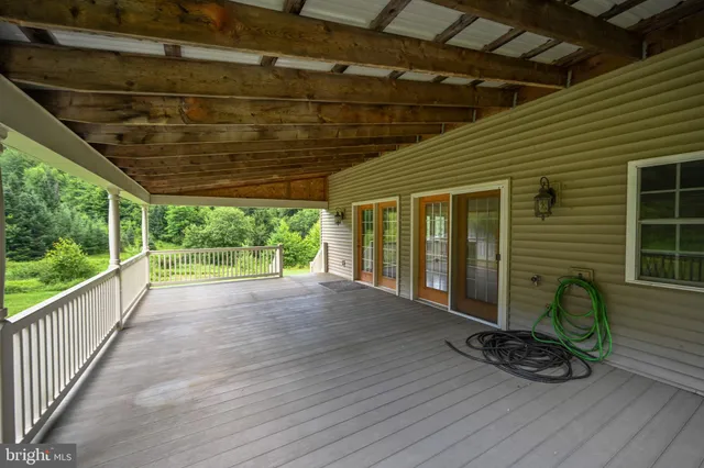 a view of a big yard with lots of green space