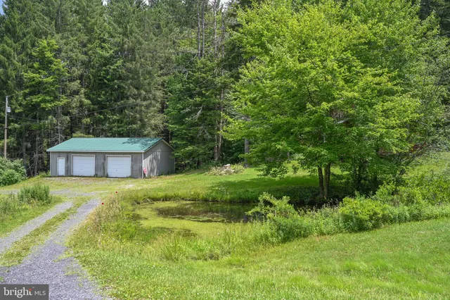 a house that has a tree in front of it