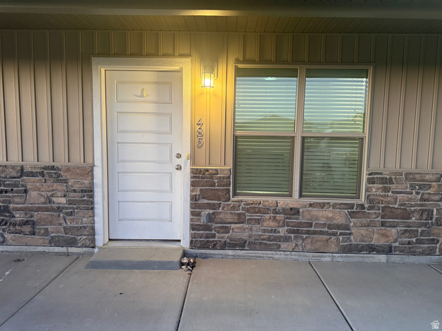 485 370 South Preston, ID 83263 - Photo 3 of 16 Entrance to property featuring stone siding, a porch, and board and batten siding
