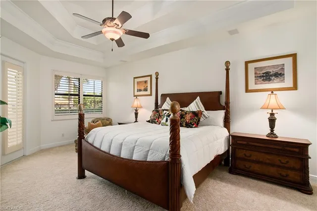 a bed room with a bed and a chandelier