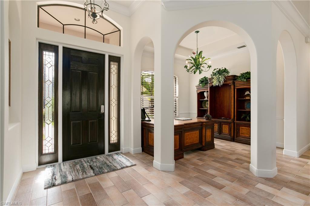 10919 Parnu Street Naples, FL 34109 - Photo 5 of 35 a view of an entryway with a chandelier