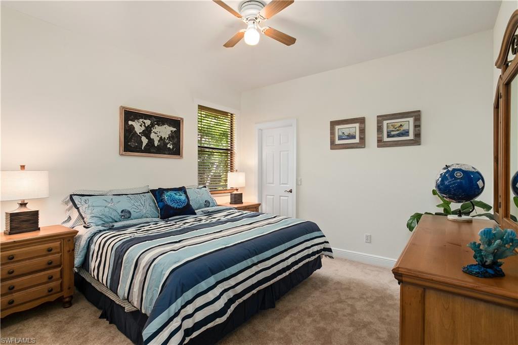 10919 Parnu Street Naples, FL 34109 - Photo 9 of 35 a bedroom with bed and a window