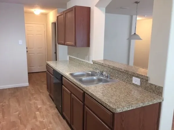 a kitchen with stainless steel appliances granite countertop a stove and a microwave