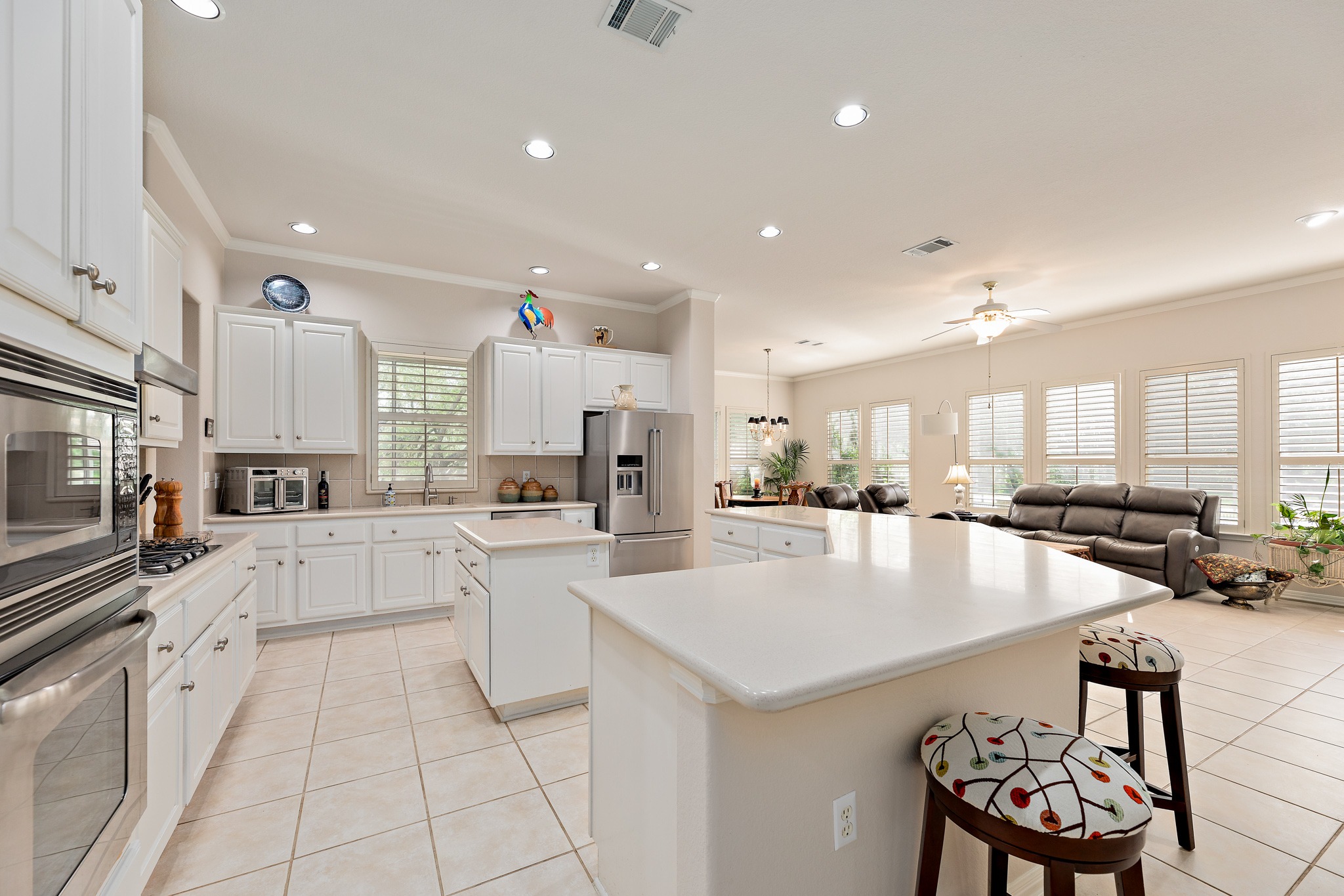106 Wild Turkey Lane Georgetown, TX 78633 - Photo 11 of 39 a large kitchen with kitchen island a sink a counter top stainless steel appliances and cabinets