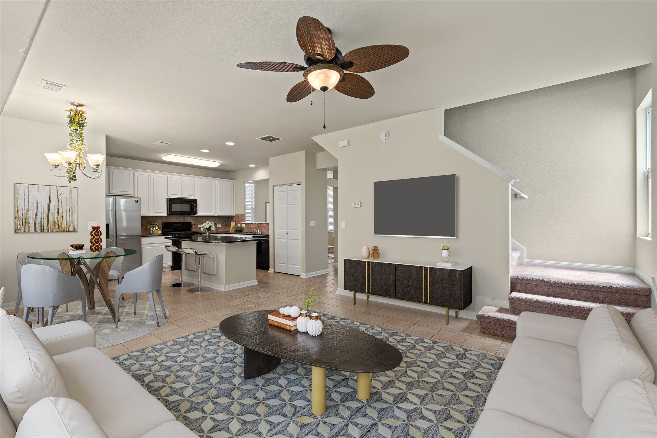 423 Wetzel Kyle, TX 78640 - Photo 12 of 35 Living room with a ceiling fan, light tile patterned floors, and suspended lighting