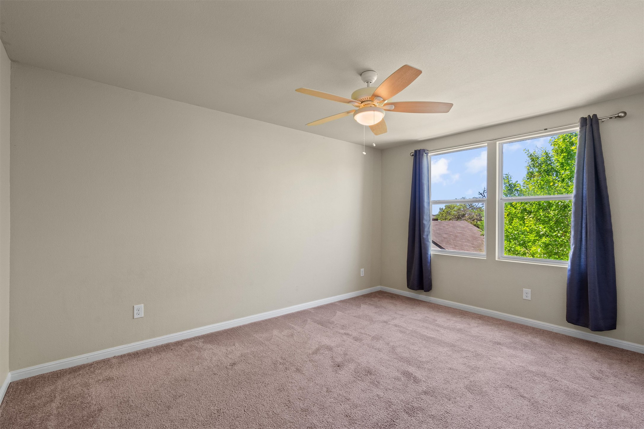 423 Wetzel Kyle, TX 78640 - Photo 25 of 35 Unfurnished room featuring light colored carpet and a ceiling fan