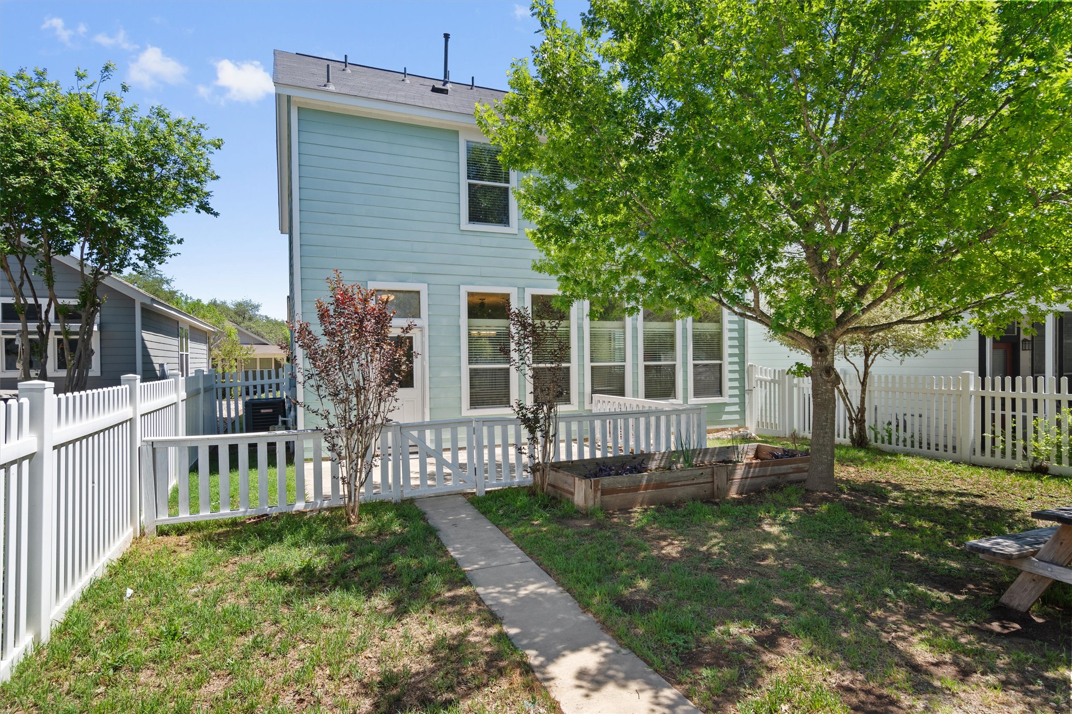 423 Wetzel Kyle, TX 78640 - Photo 30 of 35 Rear view of house with a vegetable garden