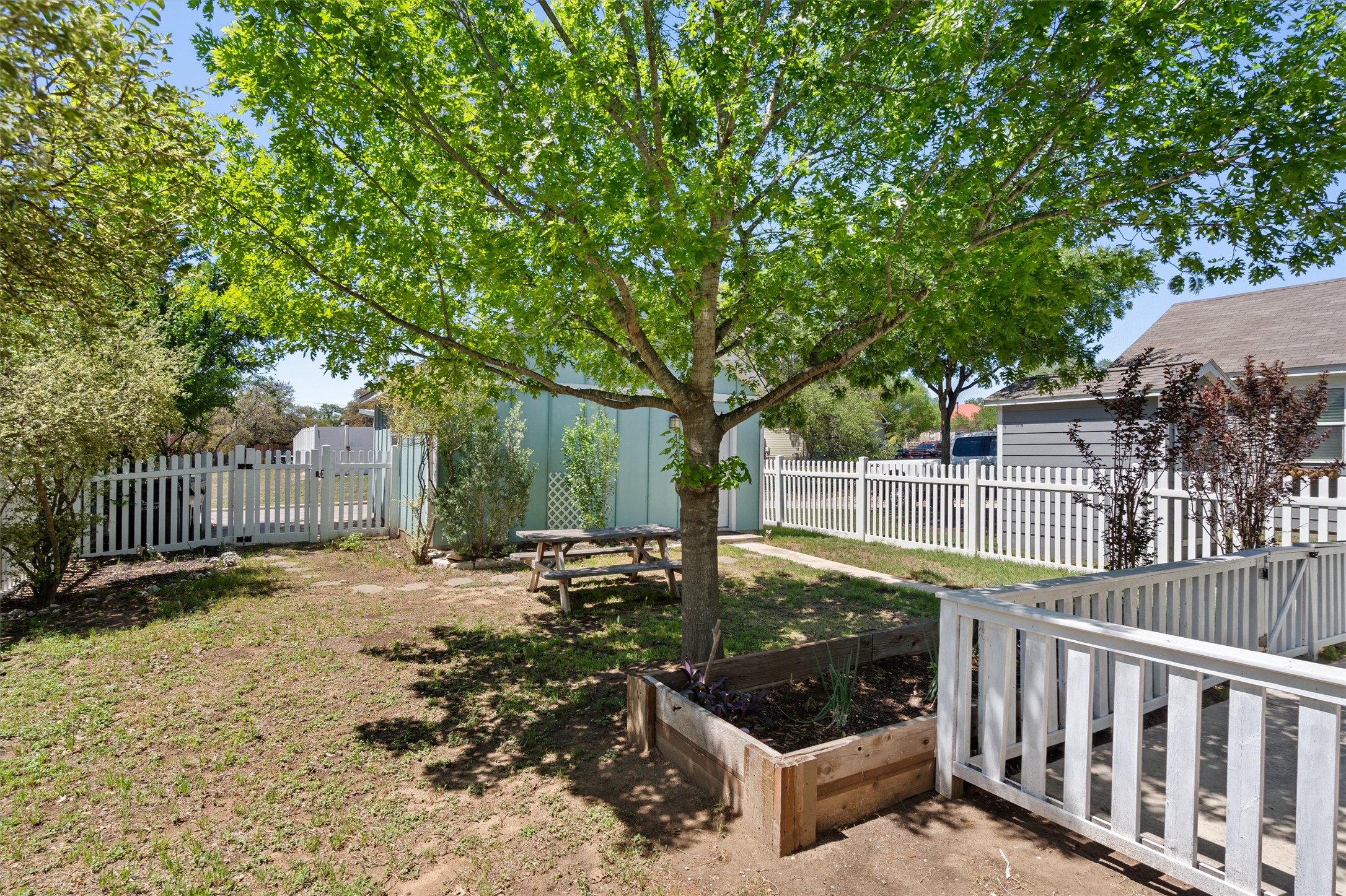 423 Wetzel Kyle, TX 78640 - Photo 33 of 35 Fenced backyard featuring a garden