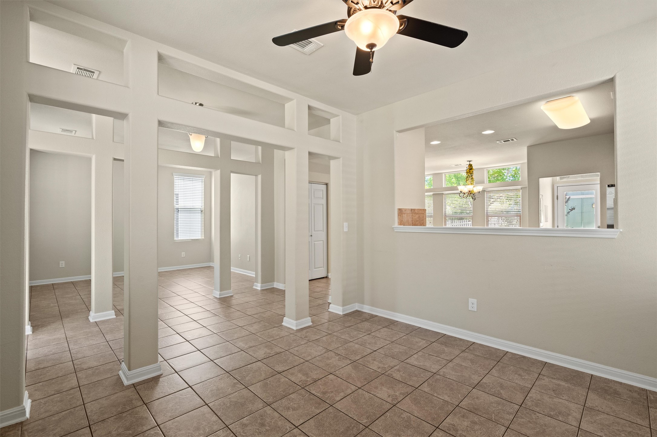 423 Wetzel Kyle, TX 78640 - Photo 10 of 35 Tiled spare room with a ceiling fan and baseboards