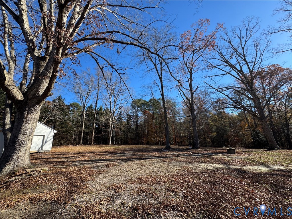 12560 Greenwood Road Glen Allen, VA 23059 - Photo 4 of 8 a backyard of a house with lots of green space