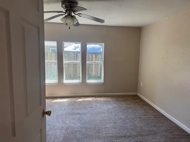 a view of an empty room with a window