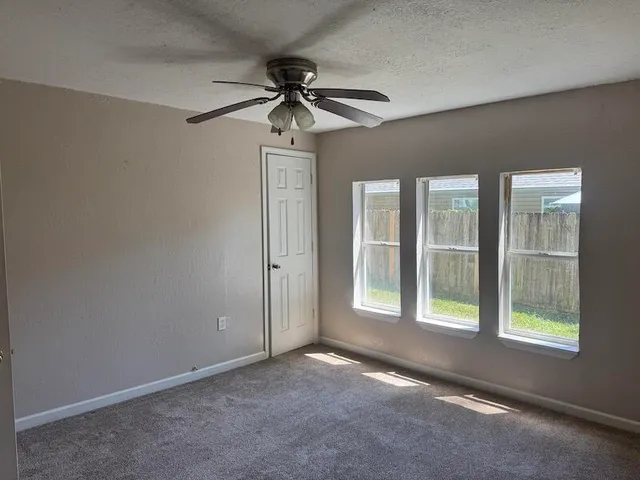a view of empty room with windows