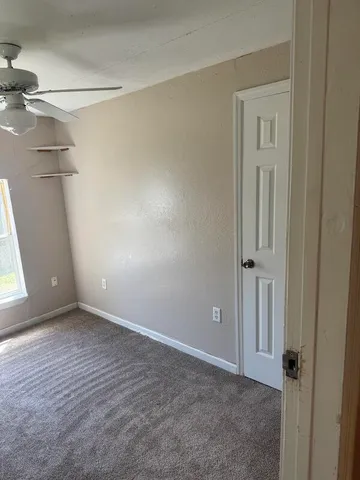 a bathroom with a glass shower door