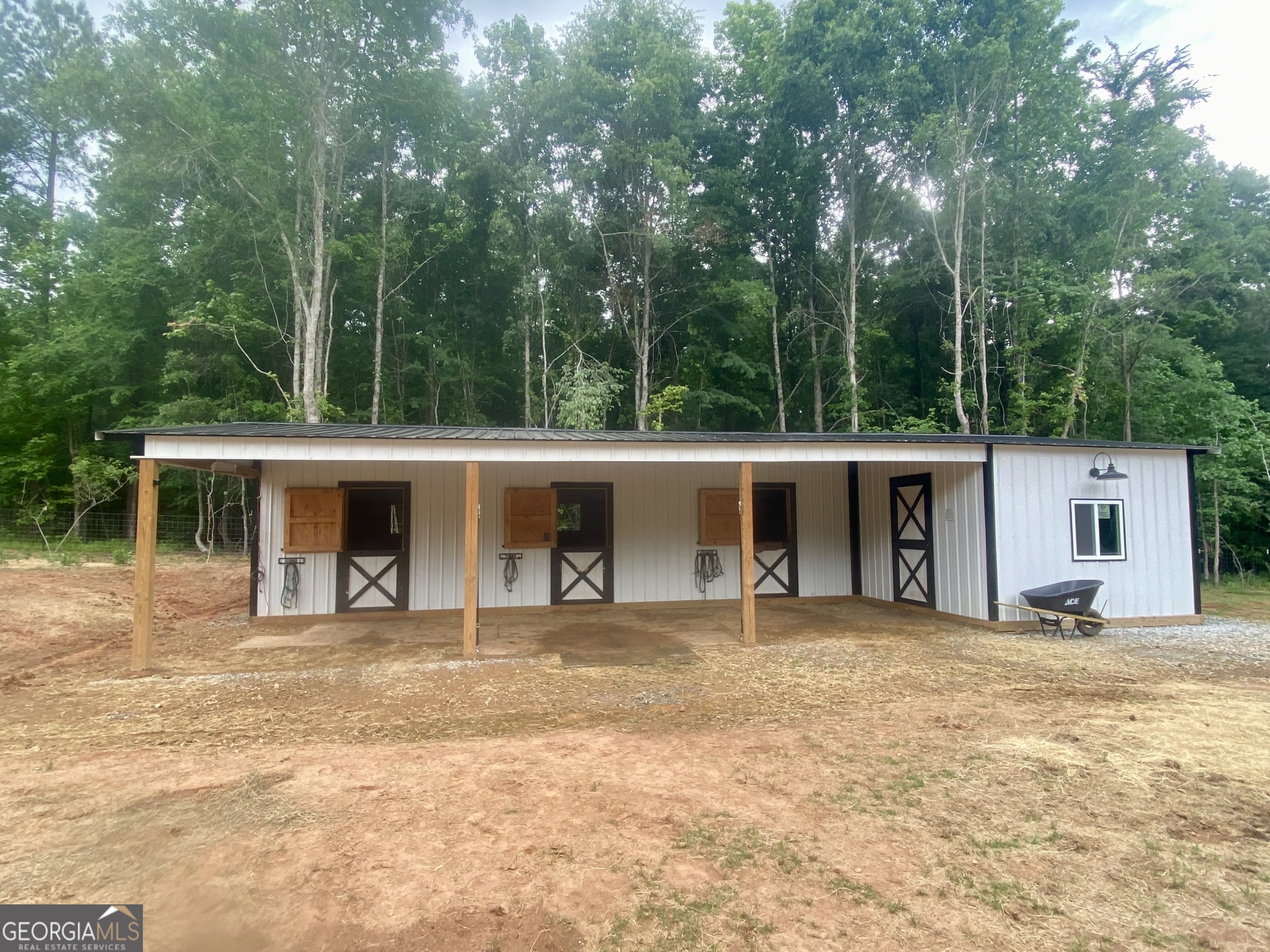 1250 Godfrey Road Madison, GA 30650 - Photo 13 of 42 a house with trees in the background