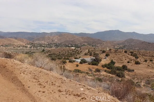 a view of a town with mountains in the background