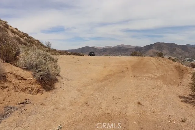 a view of a town with mountains in the background
