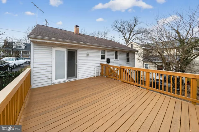 a view of a house with wooden deck