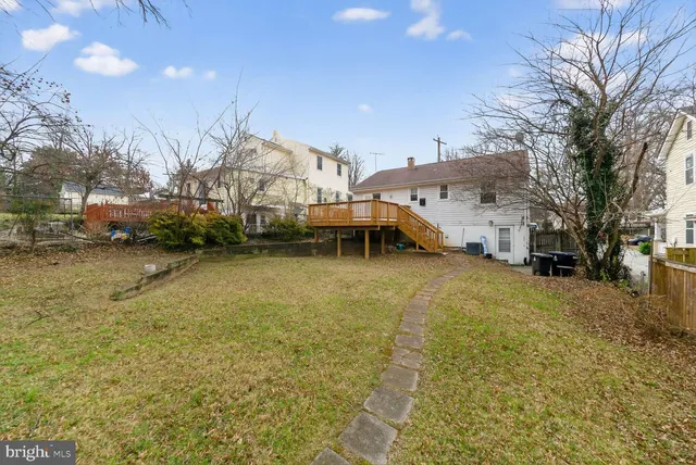 a house view with a car parked in front of it