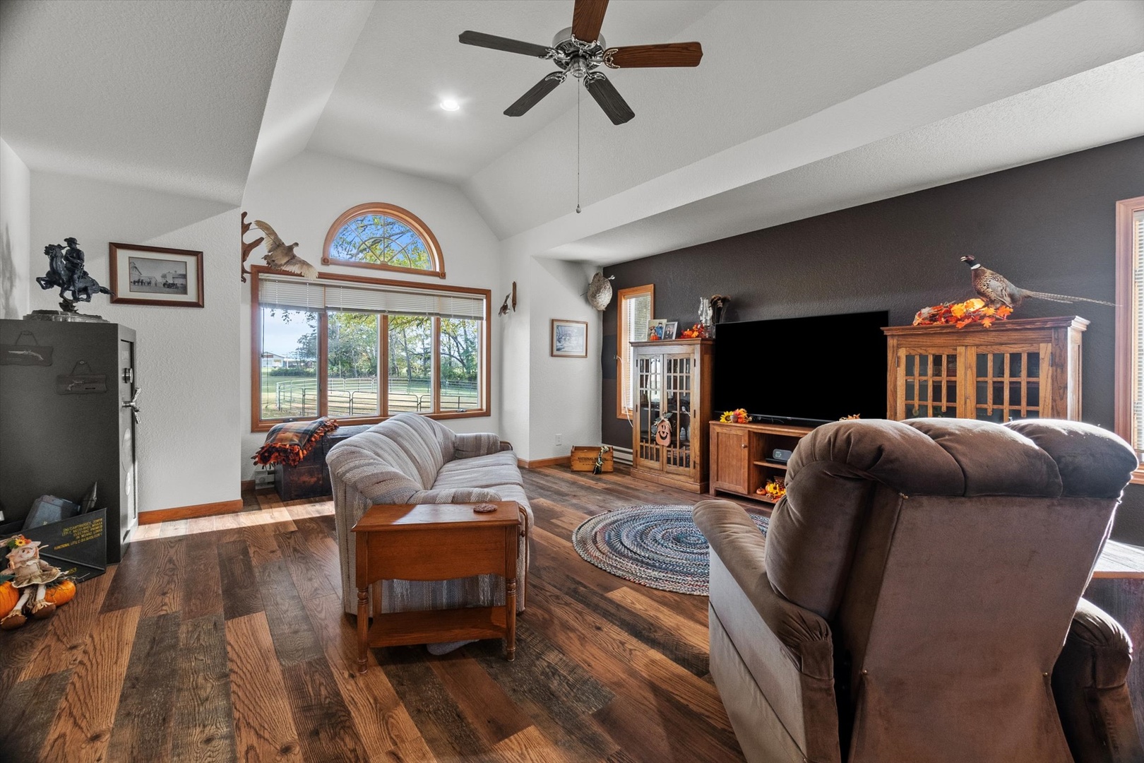 15344 Norrish Road Morrison, IL 61270 - Photo 11 of 54 a living room with furniture fireplace and a flat screen tv