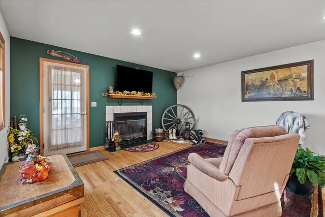 a living room with furniture fireplace and window
