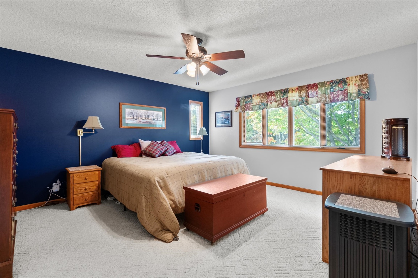 15344 Norrish Road Morrison, IL 61270 - Photo 21 of 50 a bedroom with a large bed and a chandelier