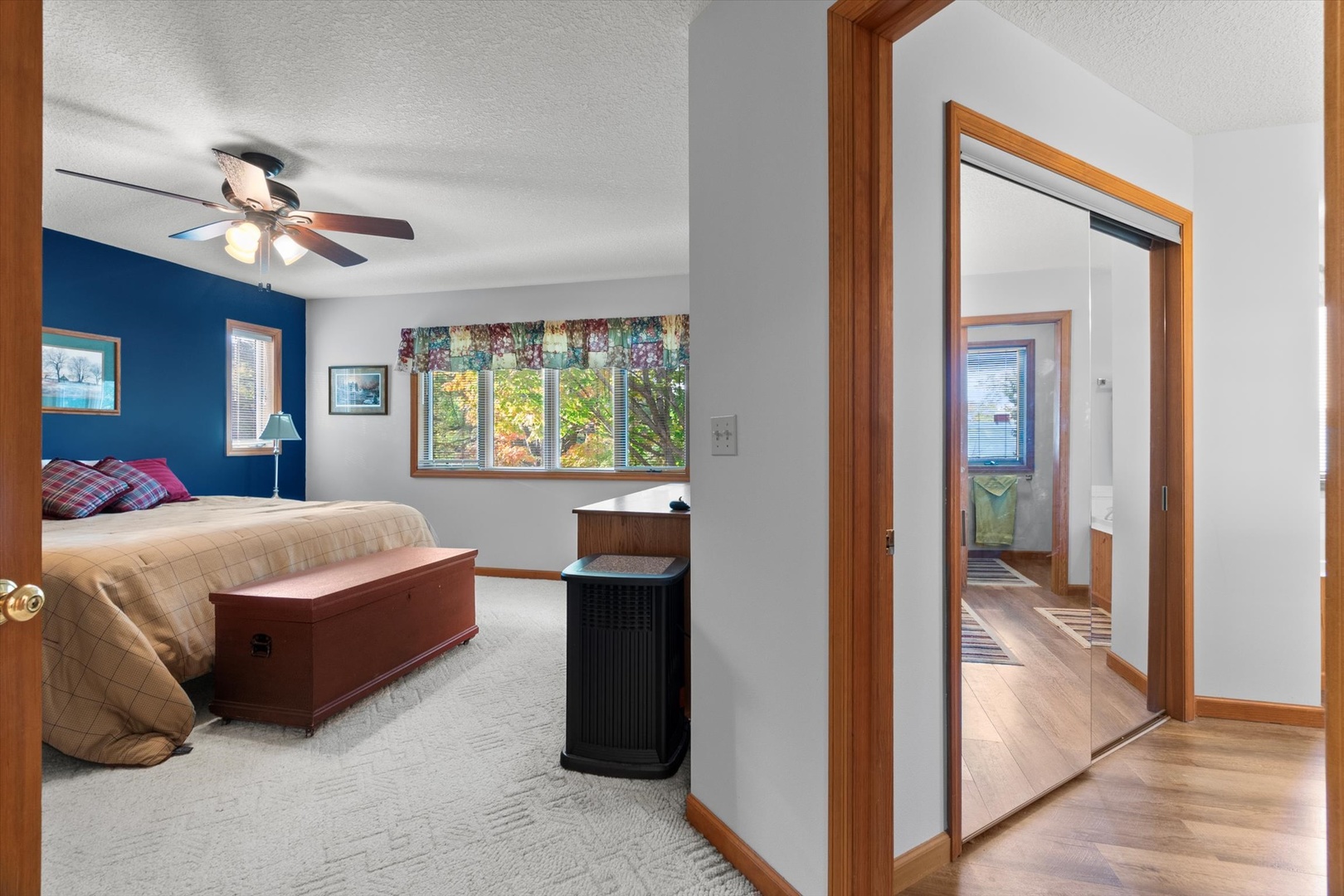 15344 Norrish Road Morrison, IL 61270 - Photo 22 of 50 a bedroom with a bed and a chandelier