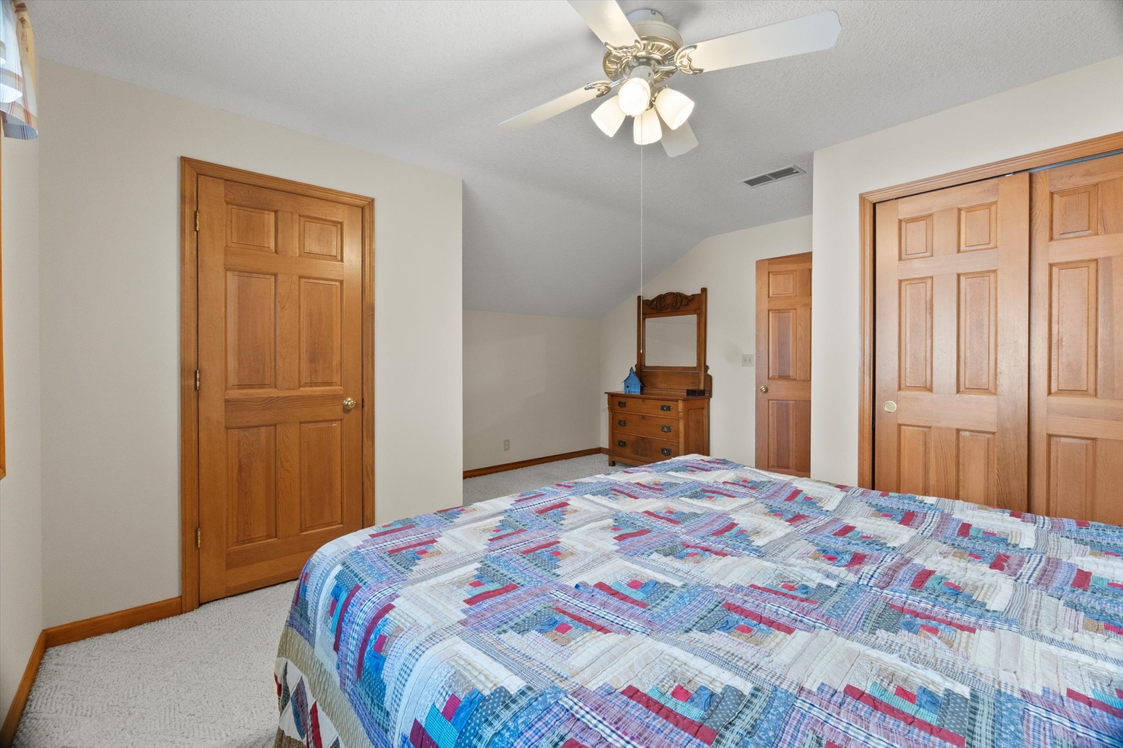 15344 Norrish Road Morrison, IL 61270 - Photo 28 of 54 a bedroom with a bed and a chandelier