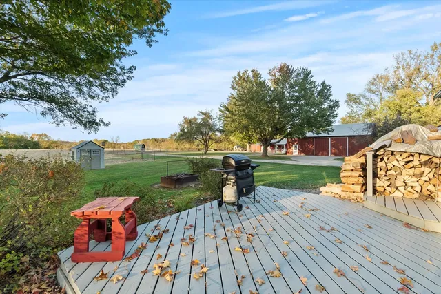 a wooden bench sitting on top of a wooden deck